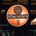 8 Wired 'Tall Poppy' tap badge