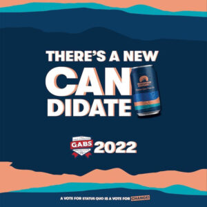 A Facebook post from Mountain Culture announcing their (ultimately succesful) first push for the Hottest 100 in 2022. The somewhat abstract colour contours from the Status Quo can (which evoke Blue Mountains horizons) form the background with large text delcaring "There's a new CANdidate" beside am image of the beer, with "GABS2022" below and (in unfairly small type at the bottom) "A vote for Status Quo is a vote for CHANGE"