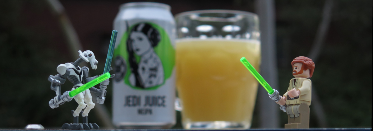 Two Lego Star Wars characters — General Grievous and Obi-Wan Kenobi from Episode II — in the foreground either side of a can of Hop Nation's Jedi Juice (which has a cartoon illustration of Princess Leia holding a blaster on it) beside a glass filled with hazy beer blurred in the background